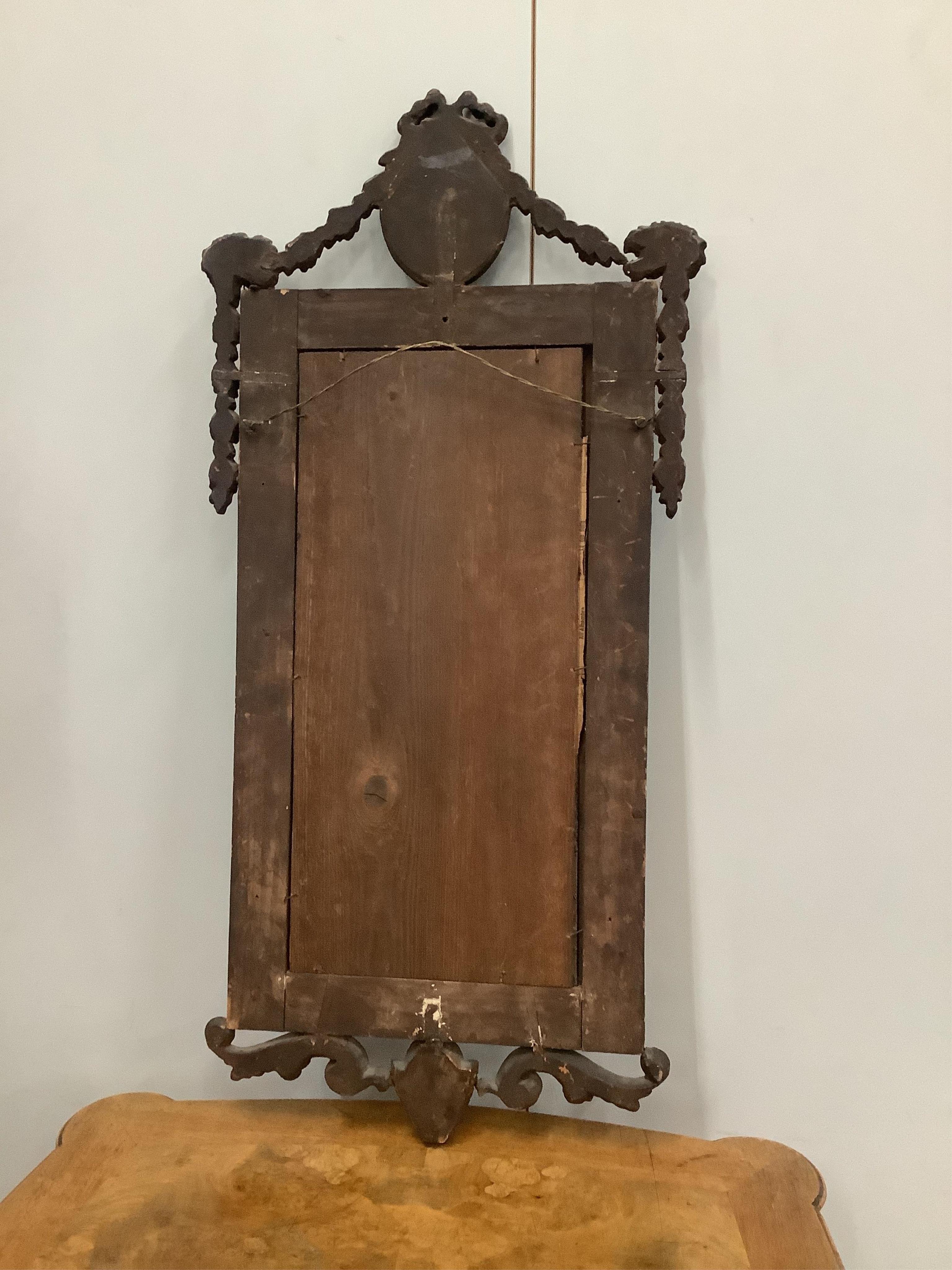 A giltwood and gesso wall mirror, with marginal plates, width 36cm, height 73cm. Condition - fair